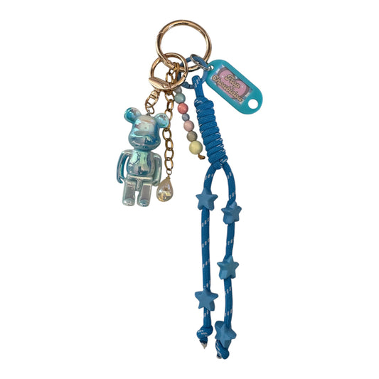 Grigri Trop Choubidou – Ourson bleu, cordon & étoiles
